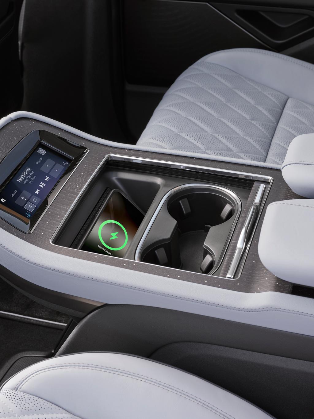 The second row of a 2026 Lincoln Black Label Navigator® with Atmospheric theme has wireless charging available in the console