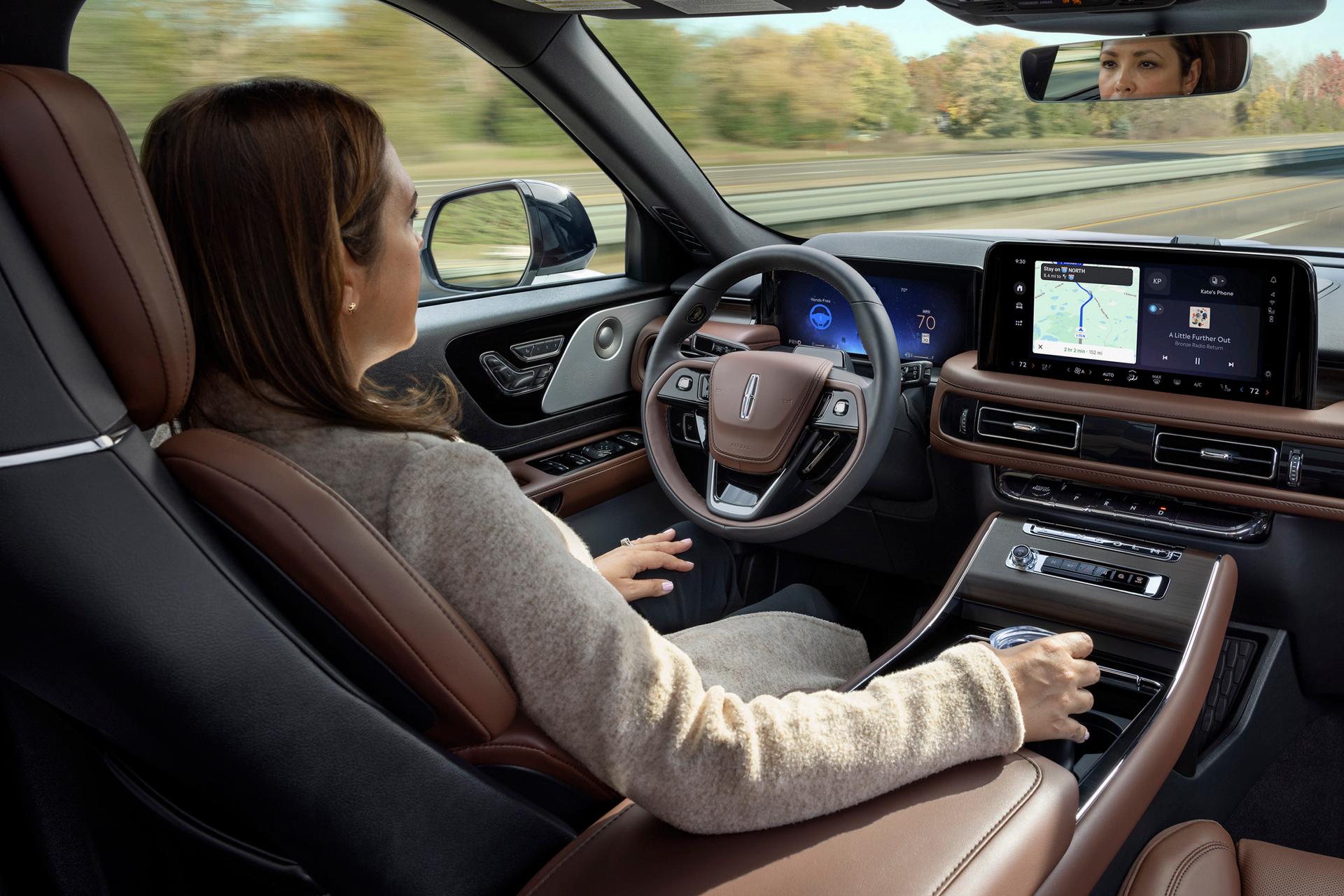 A driver of a 2027 Lincoln Aviator® SUV safely enjoys hands-free highway driving