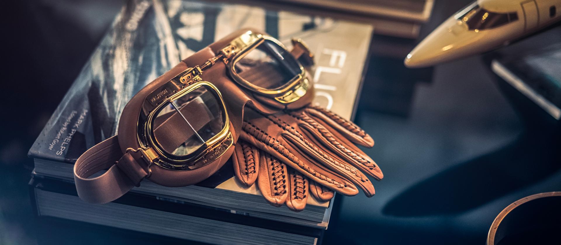 Eye goggles and leather gloves speak to the inspiration of the Flight theme