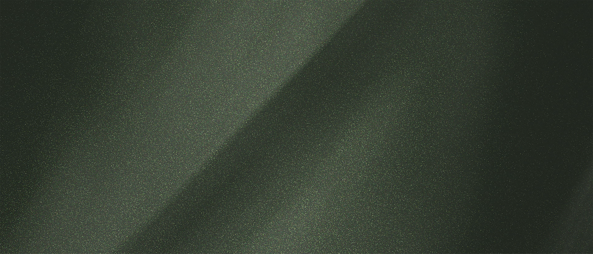 A color chip representing the extra-cost Manhattan Green Metallic Clearcoat exterior color