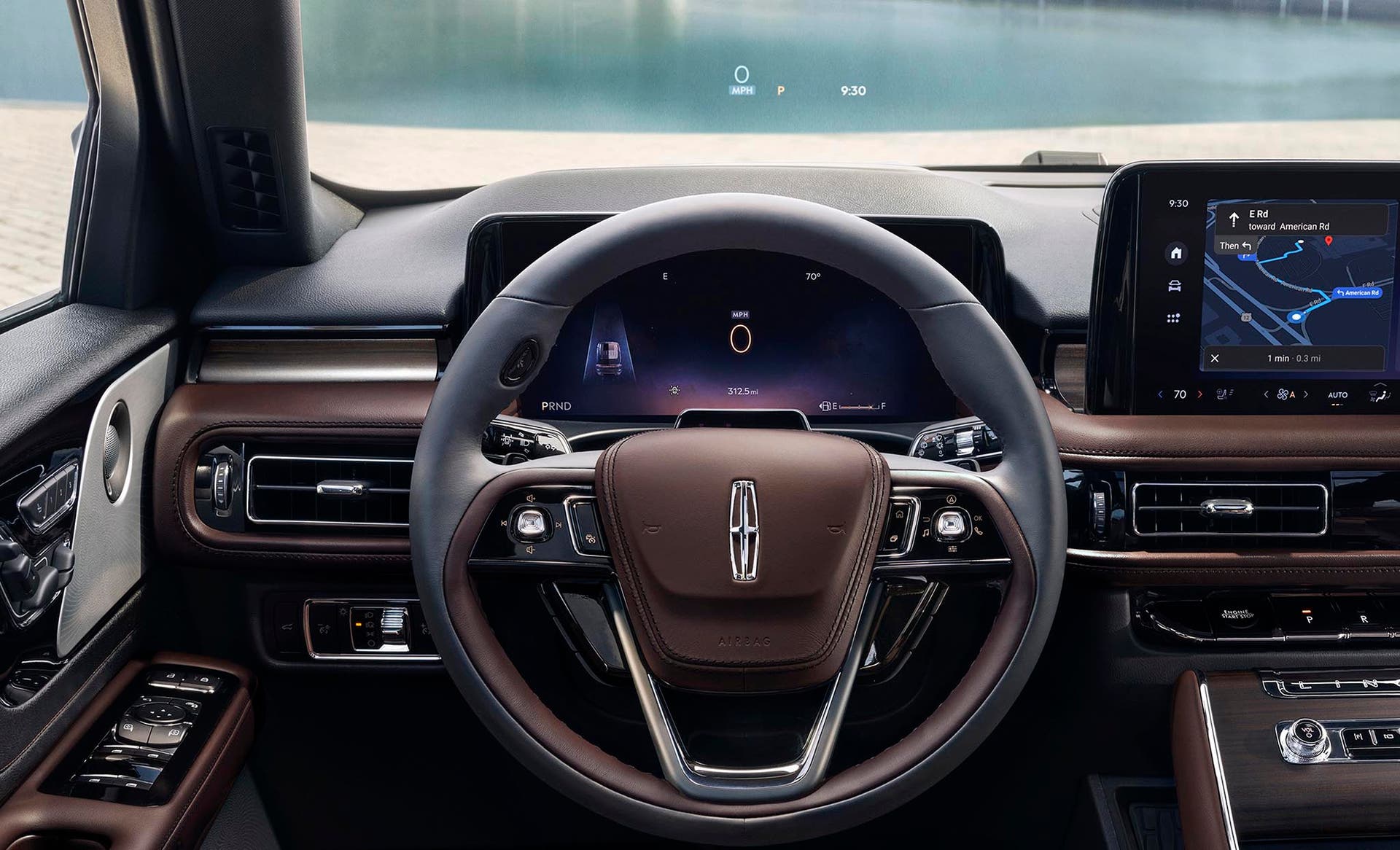 Driving information is projected on the windshield via the head up display system
