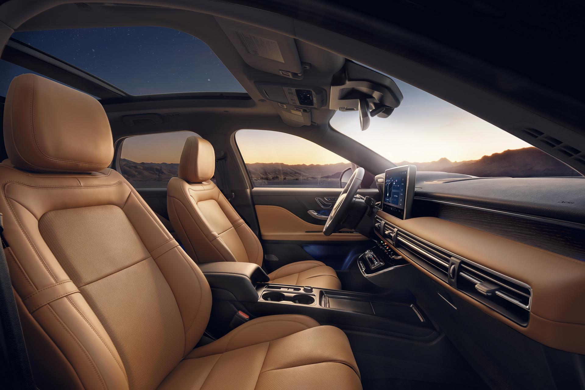 The interior of a 2027 Lincoln Corsair® Hybrid featuring Perfect Position front seats