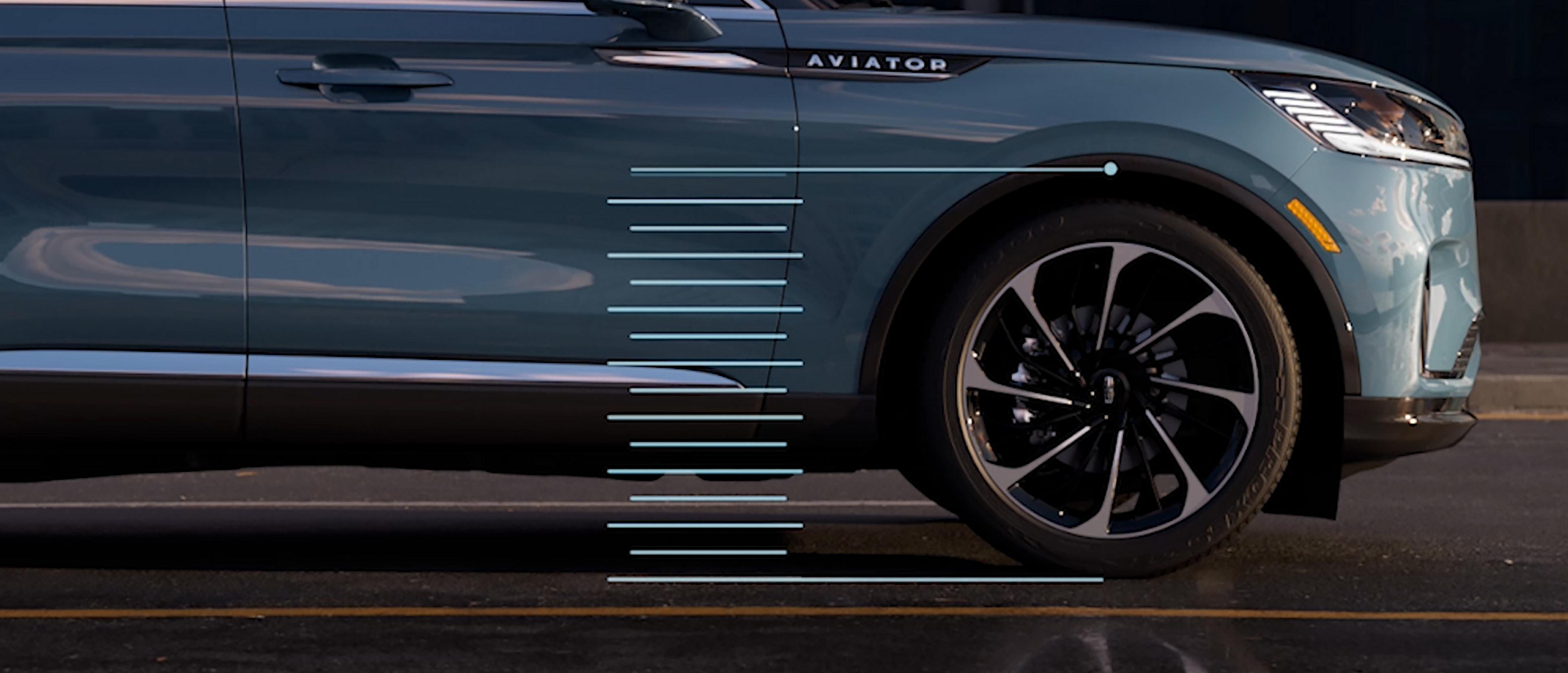 Hash marks are simulated to show how the suspension of a 2027 Lincoln Aviator® SUV can raise and lower