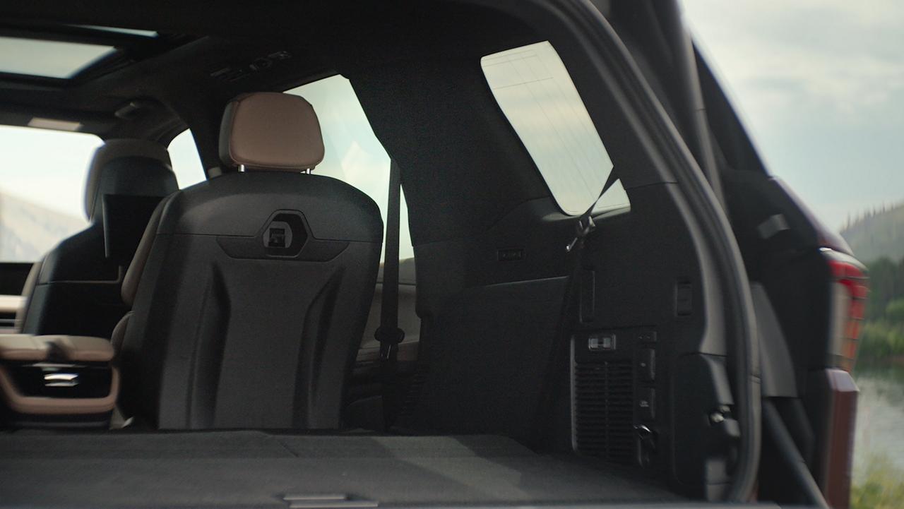 A passenger enjoys the comfort of the third row of a 2027 Lincoln Navigator® SUV