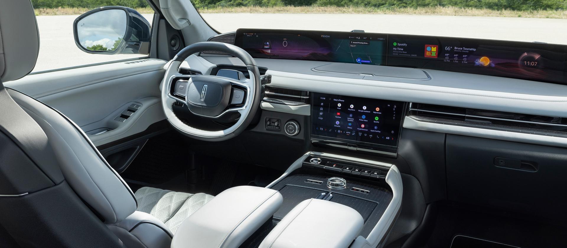 The panoramic display of a 2026 Lincoln Navigator shown with a variety of apps showing on the center stack screen