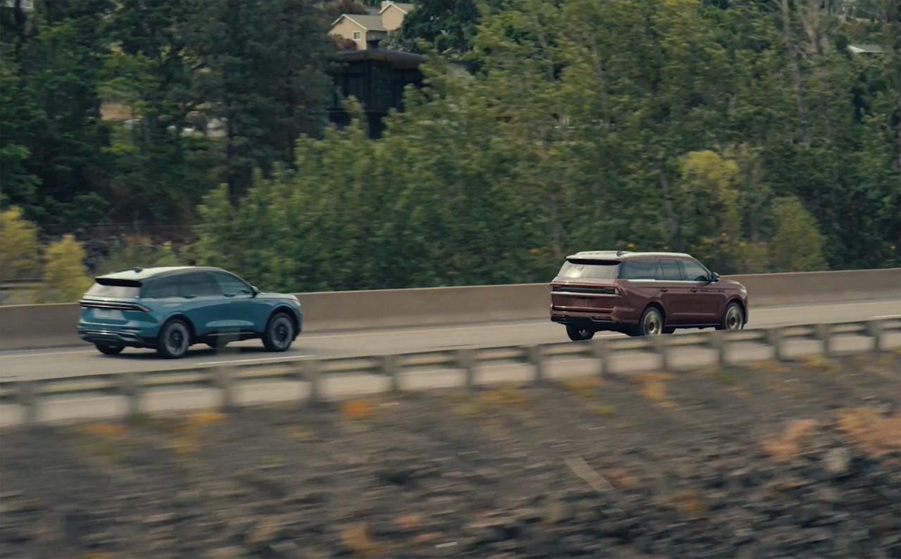 The driver's sideview mirror of a 2027 Lincoln Navigator® SUV indicating a vehicle is in the blind spot
