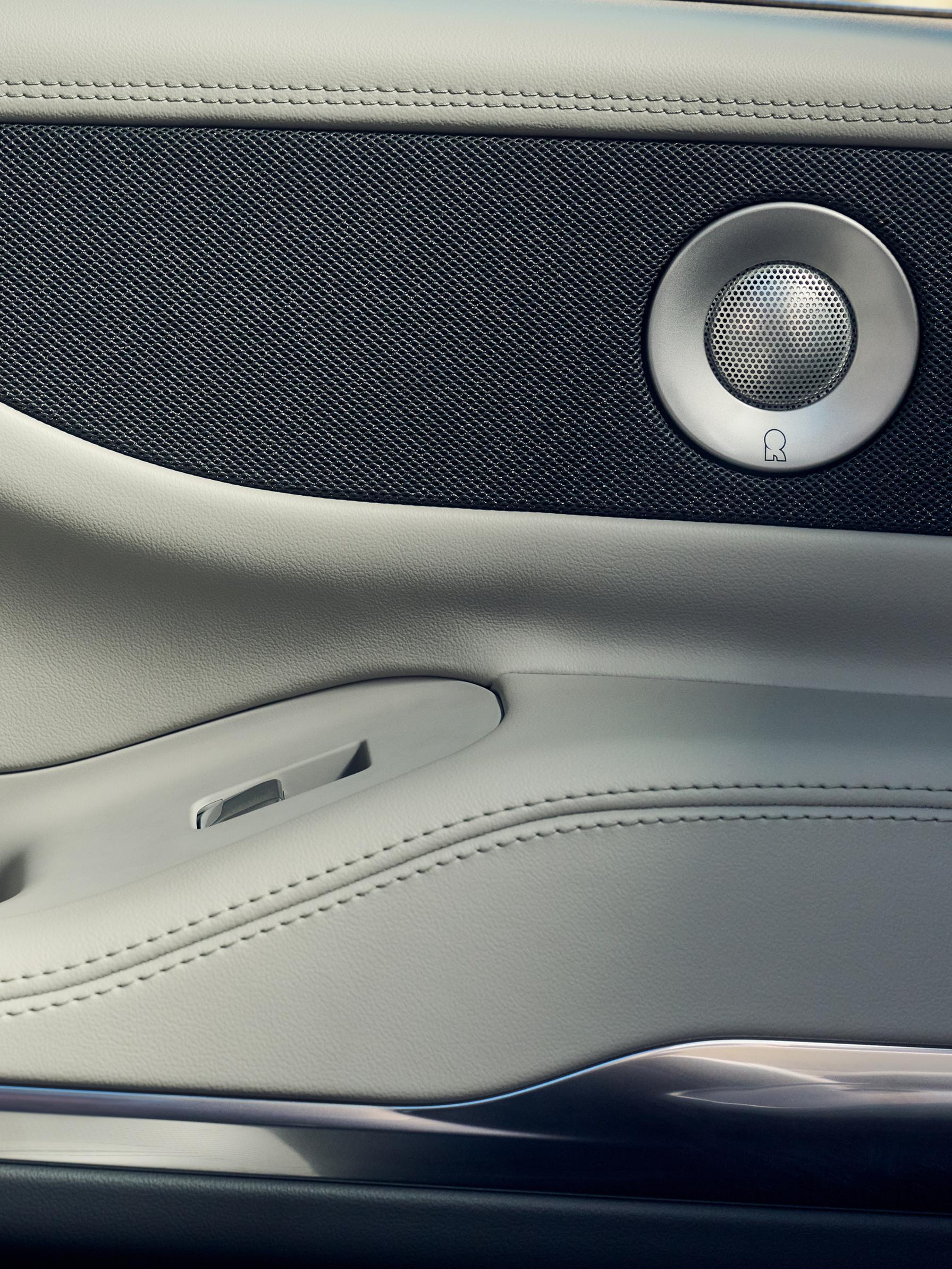 Revel® Ultima speakers are shown in the driver's door of a 2026 Lincoln Navigator® SUV.