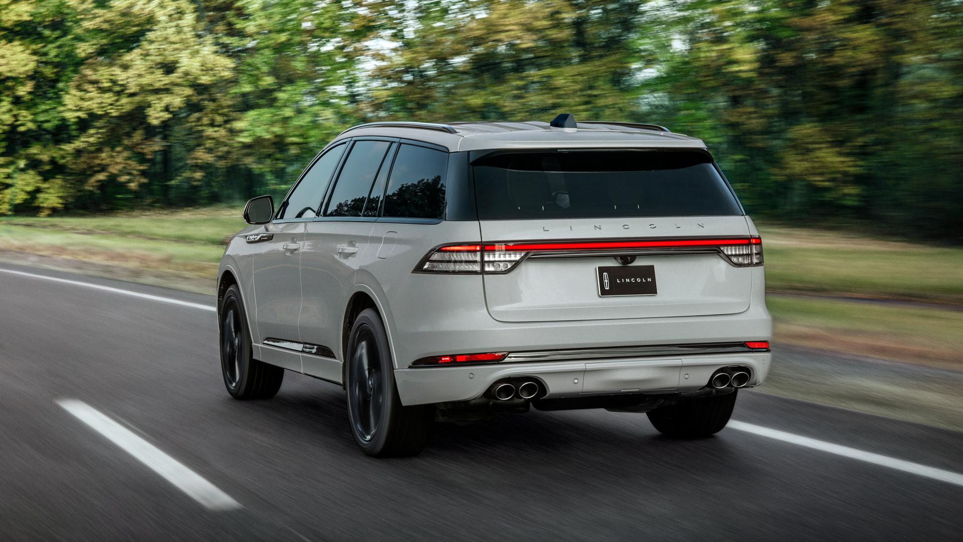 A 2027 Lincoln Aviator® SUV is being driven on a country road