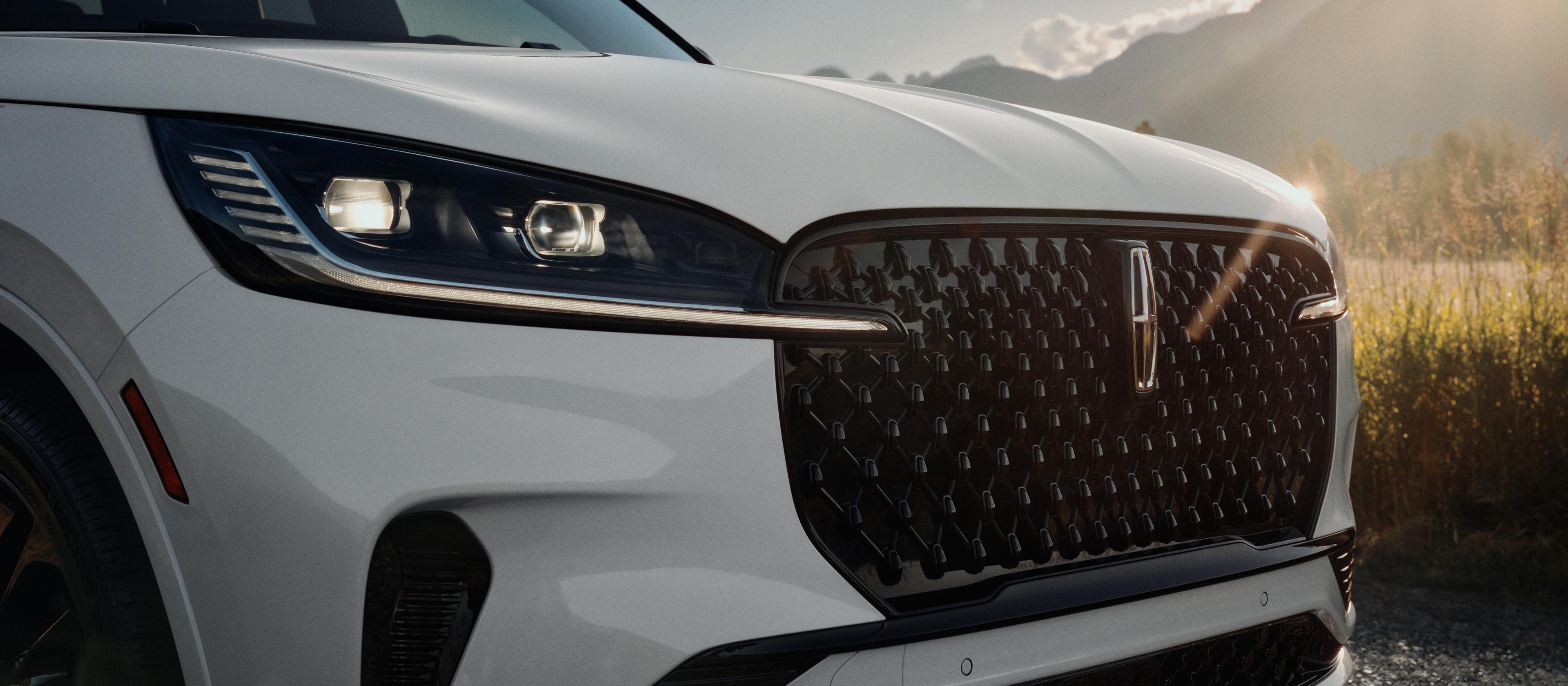 The Auto High Beam Headlamps of a 2026 Lincoln Aviator® SUV are illuminated